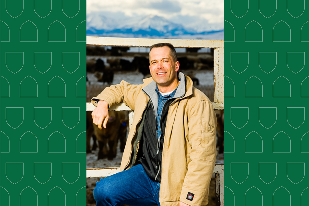 Dr. Calvin Booker in front of a corral